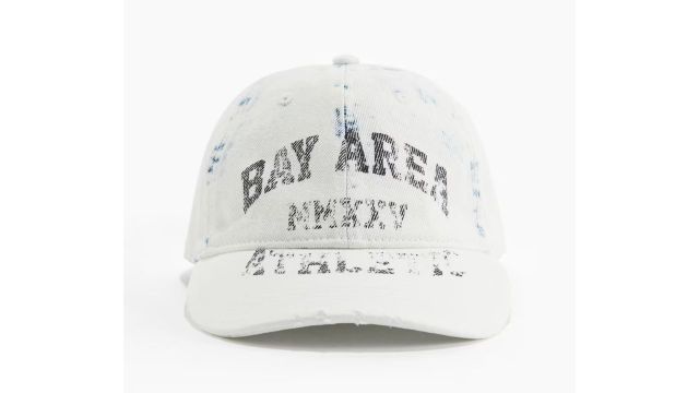 CAP WITH HARD-WORN DETAILS