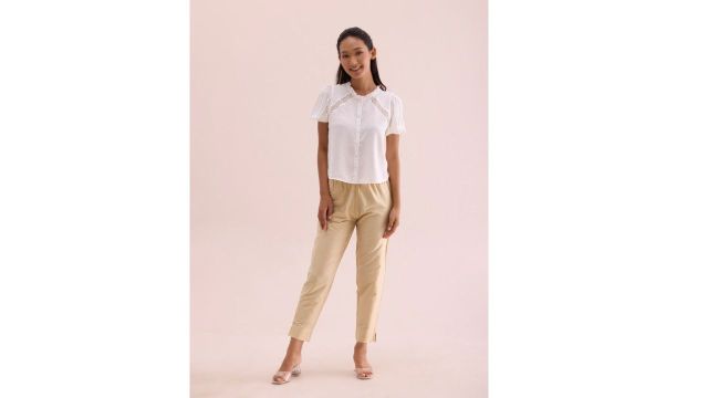 cream-colored tapered fit trousers